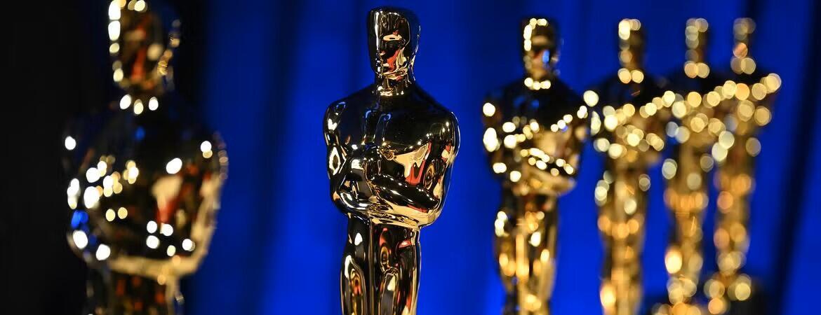 Lineup of Oscars awards on a blue background